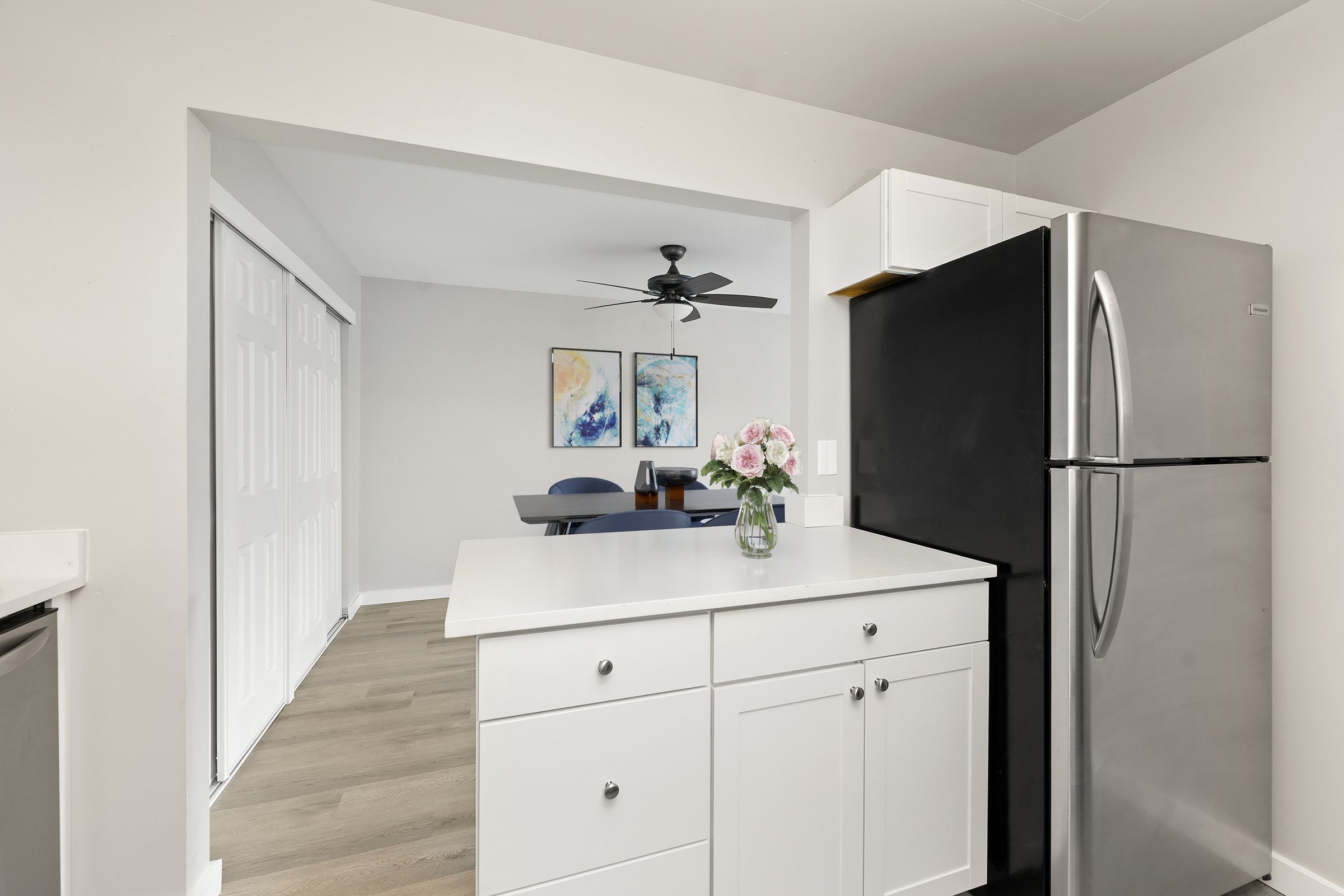 Kitchen with stainless refrigerator